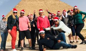 Festive King Ramses - tour group with santa hats